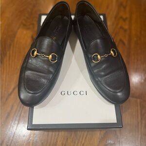Ladies black Brixton collapsible Gucci horse bit loafer with gold hardware.